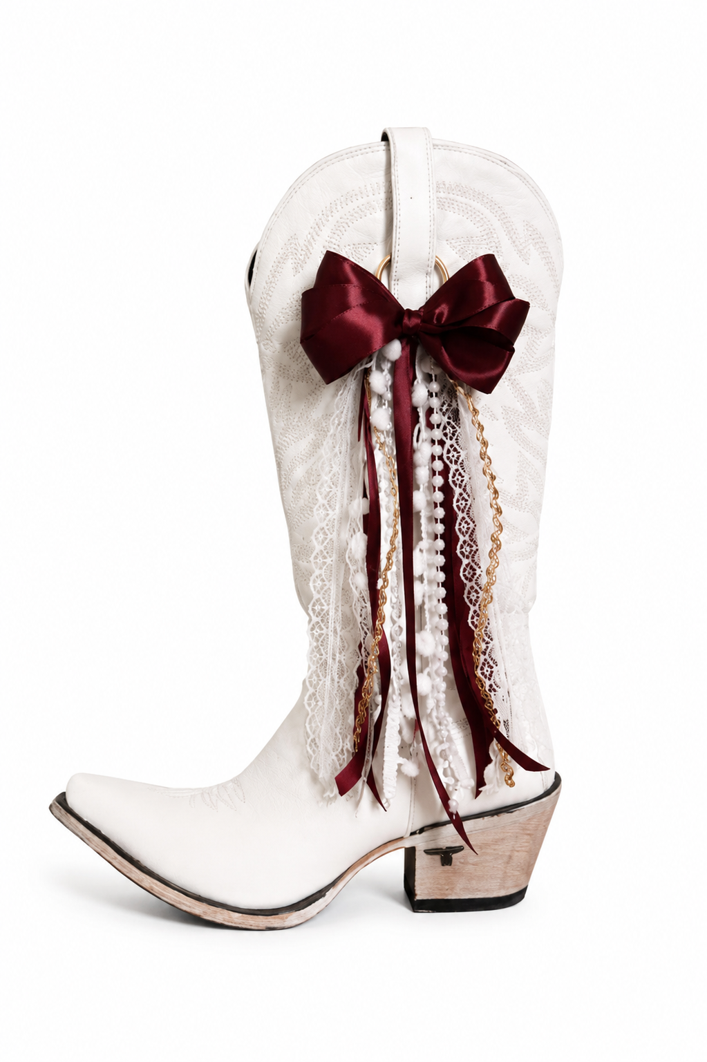 White cowboy boot with a red boot bow and decorative elements on a white background